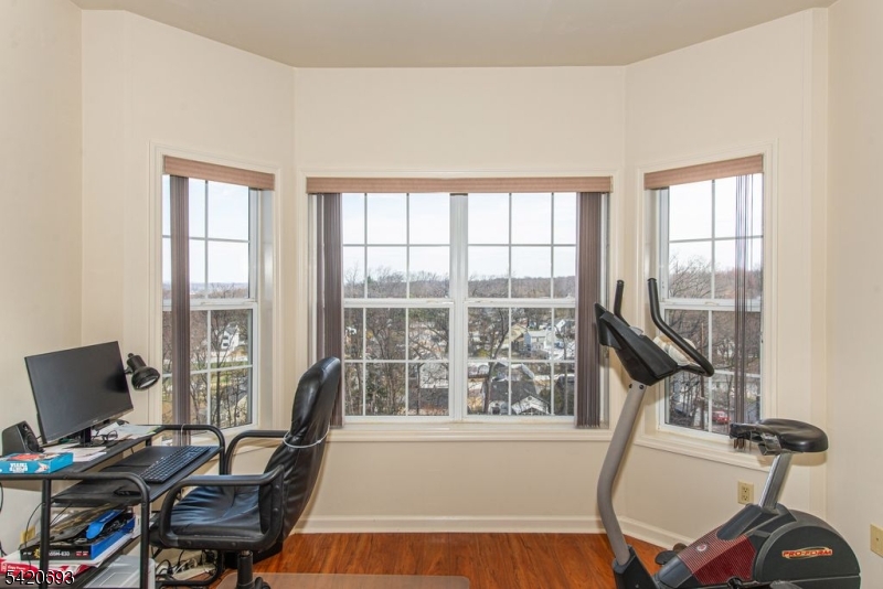 375 Rifle Camp Road, Unit 403 Woodland Park, NJ 07424 - Photo 24 of 24 a view of a workspace with furniture and a window