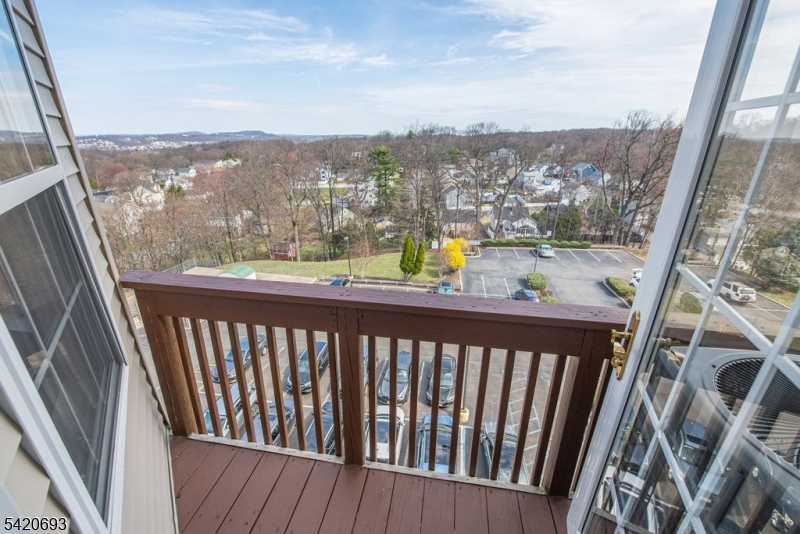375 Rifle Camp Road, Unit 403 Woodland Park, NJ 07424 - Photo 3 of 24 a view of a balcony with an ocean view