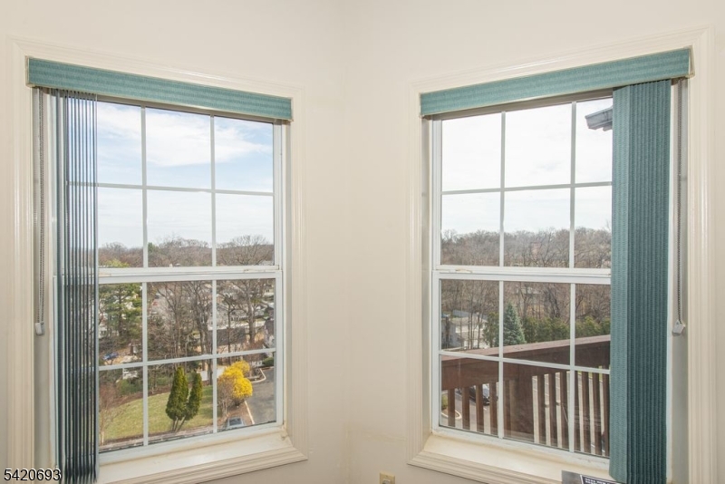 375 Rifle Camp Road, Unit 403 Woodland Park, NJ 07424 - Photo 4 of 24 a view of a window and an outdoor space