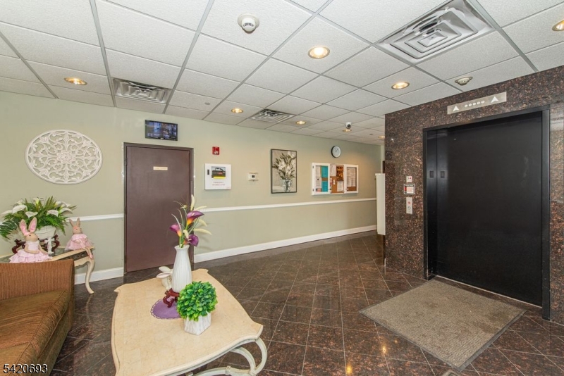 375 Rifle Camp Road, Unit 403 Woodland Park, NJ 07424 - Photo 7 of 24 a view of an entryway with dining area