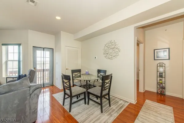 a view of a livingroom with furniture and wooden floor
