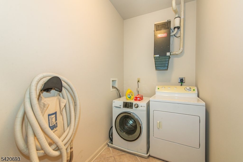 375 Rifle Camp Road, Unit 403 Woodland Park, NJ 07424 - Photo 10 of 24 a utility room with dryer and washer