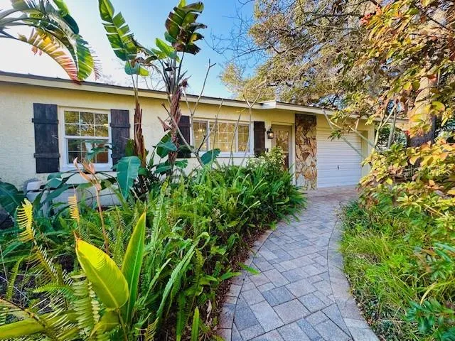 front view of a house with a garden