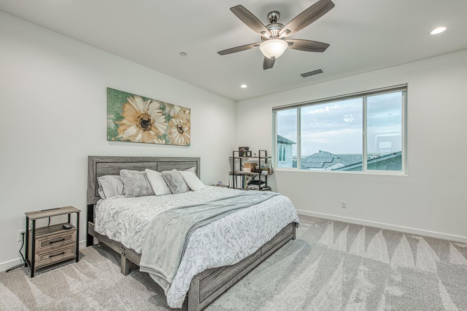 849 Livio Way Madera, CA 93636 - Photo 36 of 74 a bedroom with a large bed and a large window