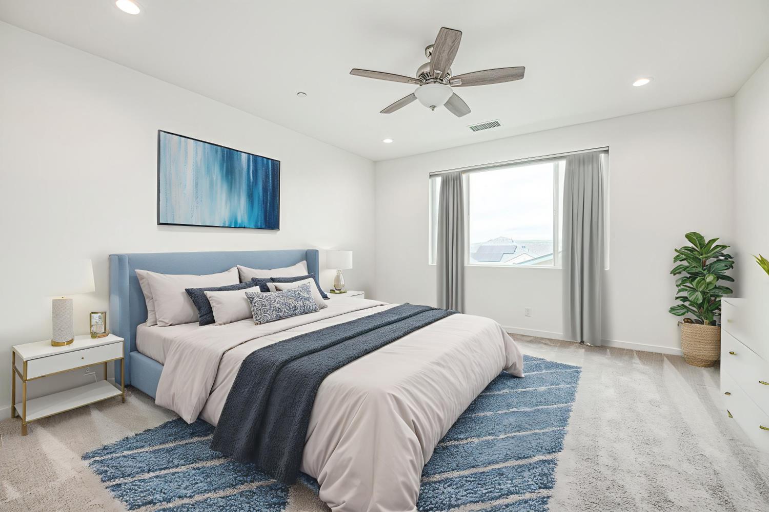 849 Livio Way Madera, CA 93636 - Photo 9 of 74 a bedroom with a large bed and a chandelier