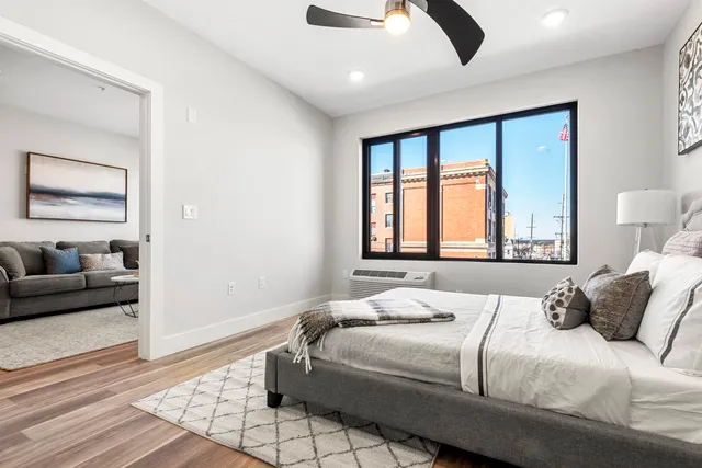 a bedroom with a large bed and a couch