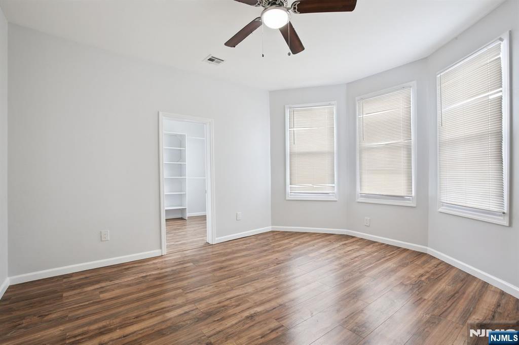 750 South 17th Street Newark, NJ 07103 - Photo 16 of 25 a view of empty room with wooden floor and window