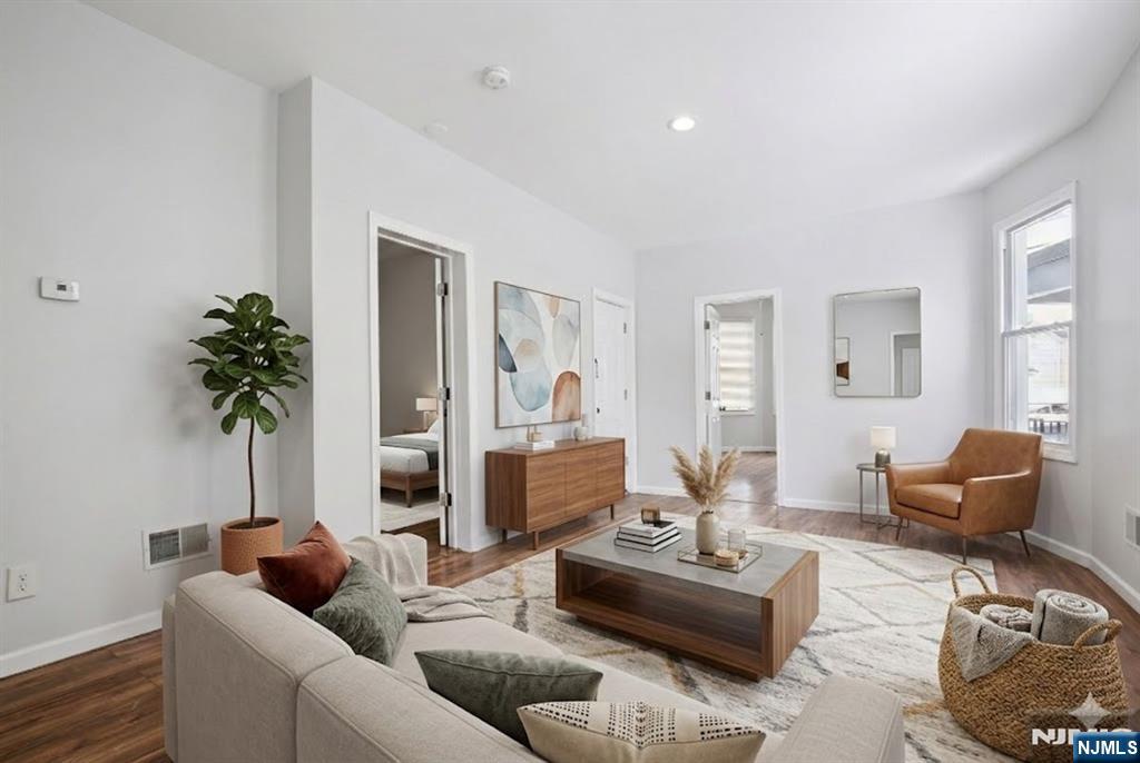 750 South 17th Street Newark, NJ 07103 - Photo 2 of 25 a living room with furniture and a large window