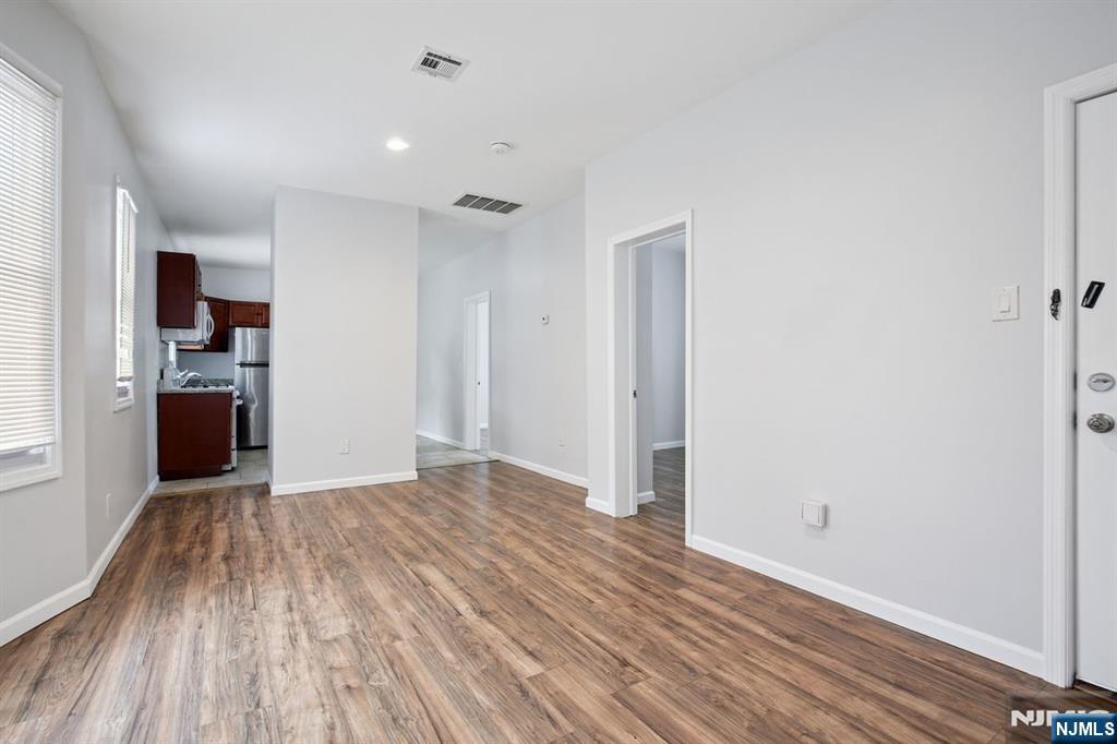 750 South 17th Street Newark, NJ 07103 - Photo 4 of 25 a view of empty room with wooden floor