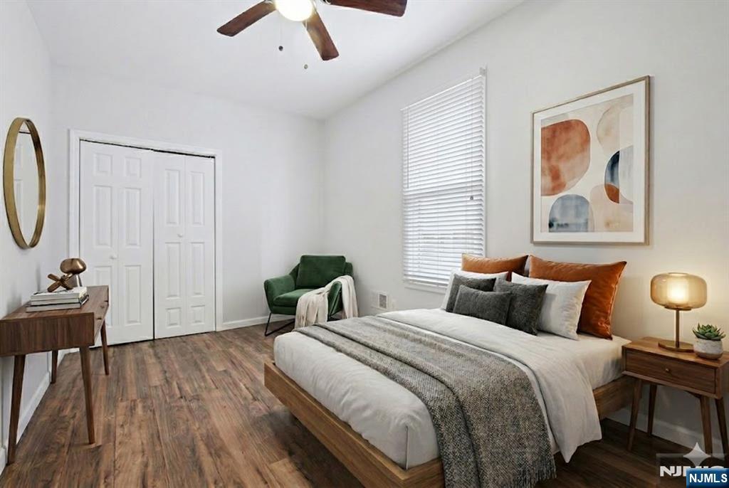 750 South 17th Street Newark, NJ 07103 - Photo 7 of 25 a bedroom with bed and a chandelier