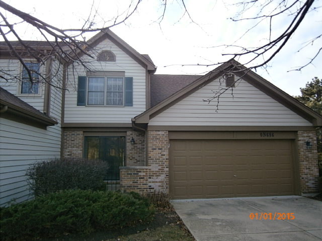N686 Chelsea Circle Winfield, IL 60190 - Photo 1 of 25 a front view of a house with garage