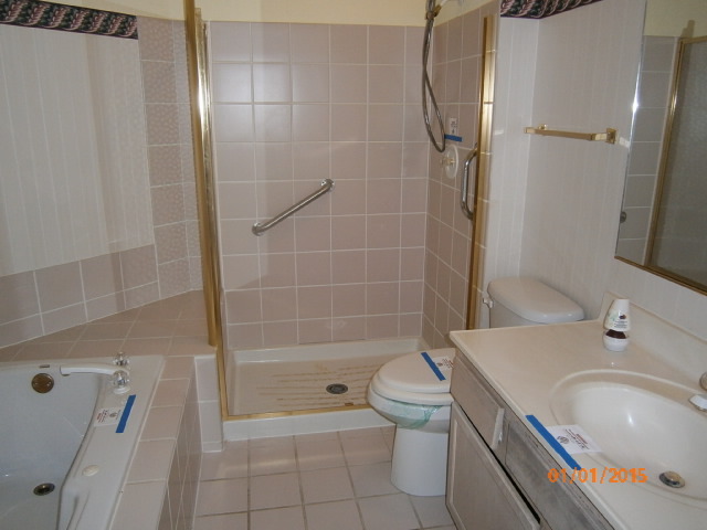N686 Chelsea Circle Winfield, IL 60190 - Photo 14 of 25 a bathroom with a sink a toilet and shower