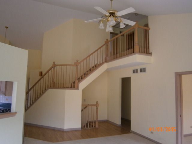 N686 Chelsea Circle Winfield, IL 60190 - Photo 15 of 25 a view of entryway and hall with wooden floor
