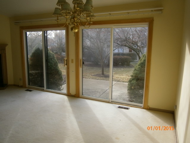 N686 Chelsea Circle Winfield, IL 60190 - Photo 8 of 25 a view of an empty room with a glass door