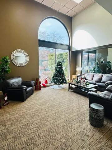 an empty room with windows and entrance