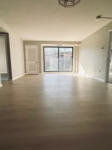 a kitchen with stainless steel appliances wooden cabinets a stove and a microwave