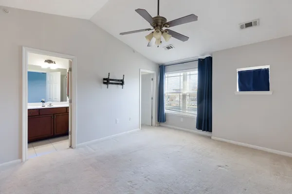 a view of an empty room with a bathroom