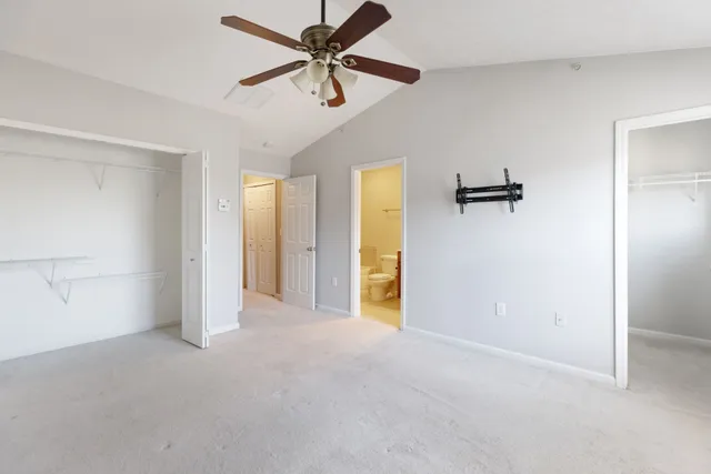 a view of empty room with ceiling fan