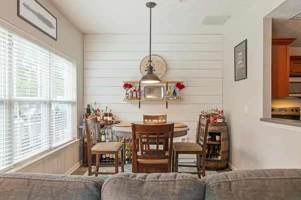 a view of a dining room with furniture window and outside view