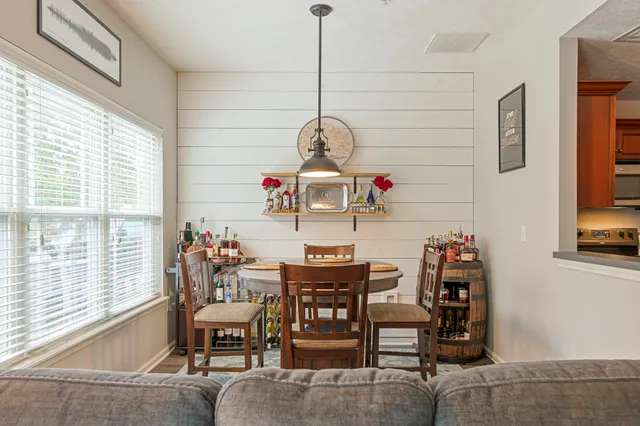 a view of a dining room with furniture window and outside view