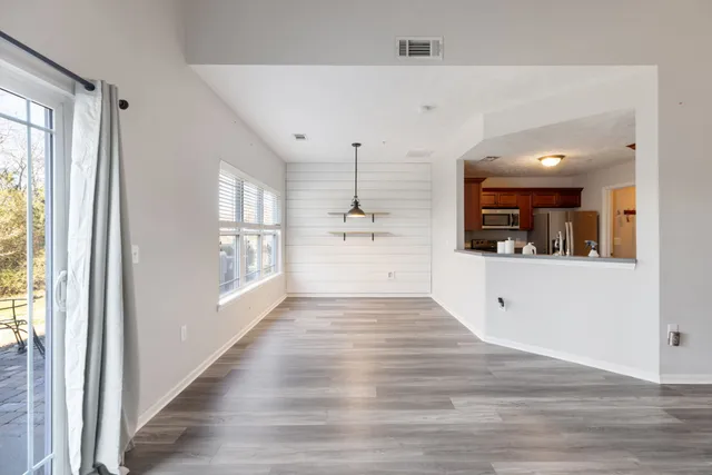 a view of a kitchen with a sink and windows