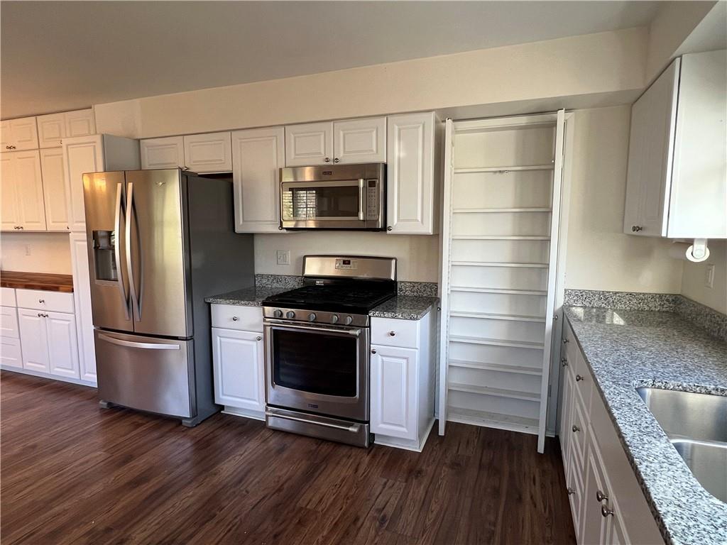 143 La Ray Drive Butler, PA 16001 - Photo 11 of 43 a kitchen with stainless steel appliances and wooden cabinets