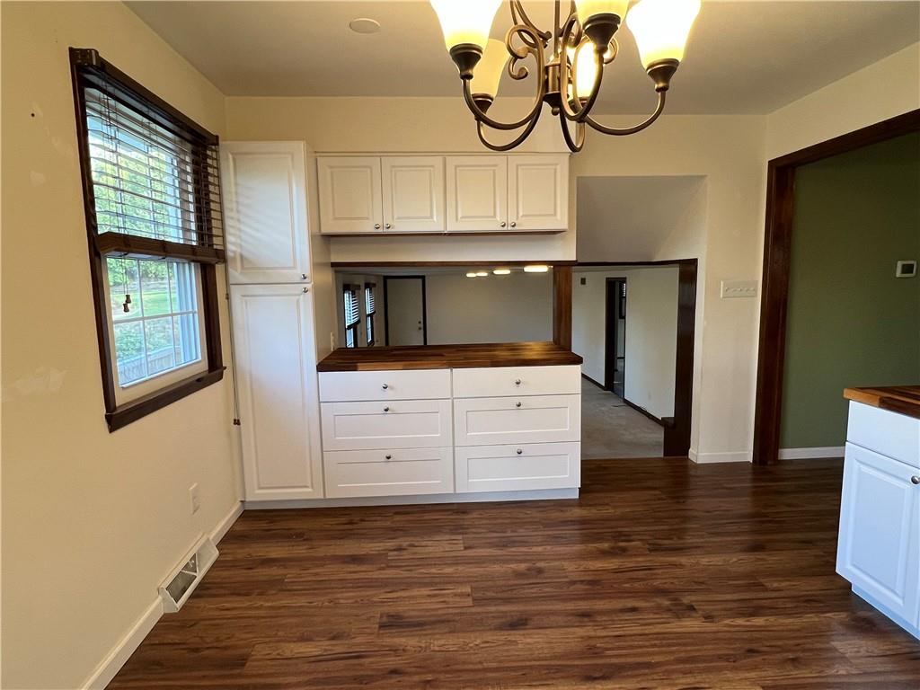 143 La Ray Drive Butler, PA 16001 - Photo 14 of 43 a view of a hallway with wooden floor and cabinet