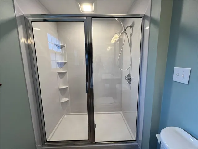 a bathroom with a sink vanity and toilet