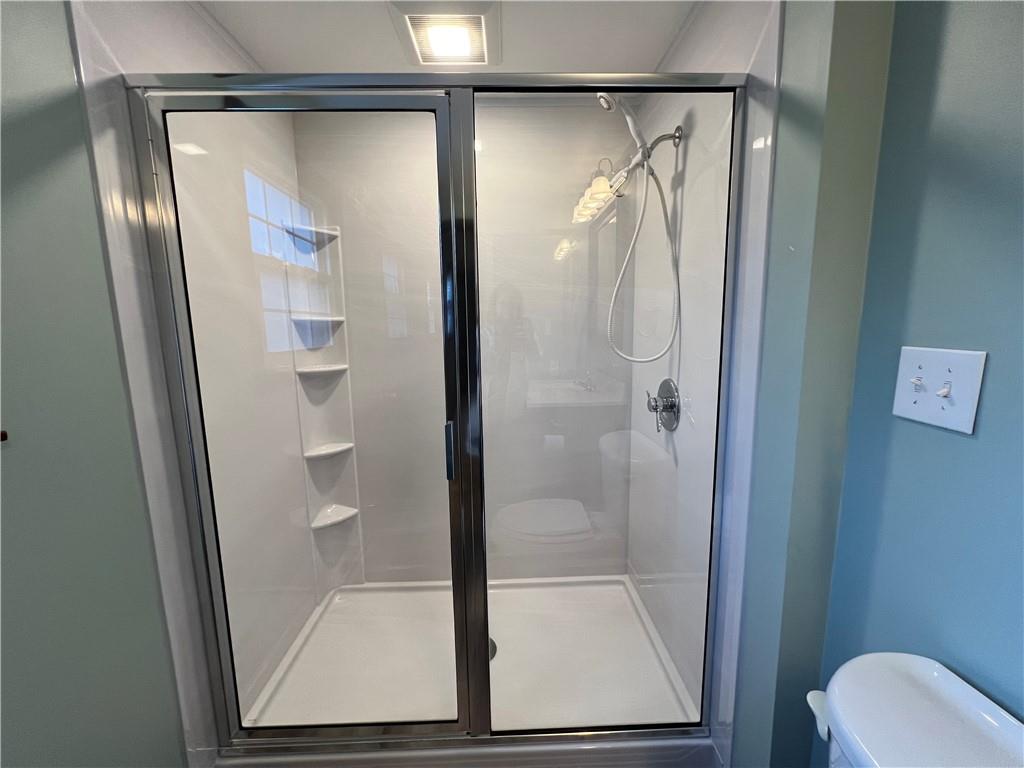 143 La Ray Drive Butler, PA 16001 - Photo 30 of 43 a bathroom with a glass shower door