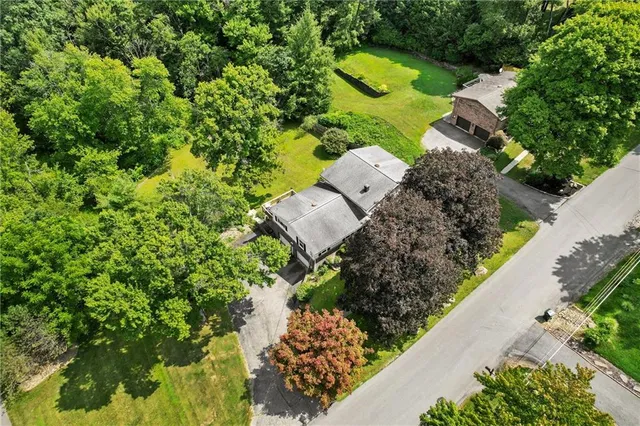 an aerial view of a house with a garden
