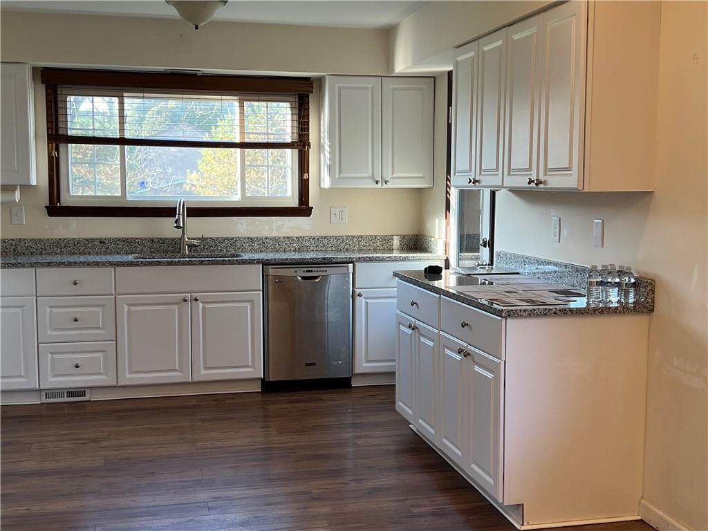 143 La Ray Drive Butler, PA 16001 - Photo 9 of 43 a kitchen with granite countertop white cabinets and a window