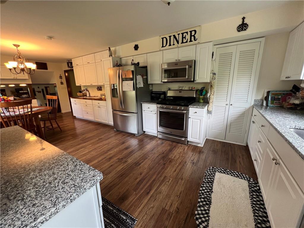 143 La Ray Drive Butler, PA 16001 - Photo 10 of 43 a kitchen with stainless steel appliances kitchen island granite countertop a stove and a sink