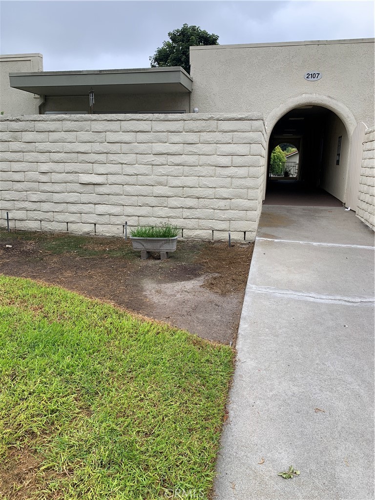 2107 Ronda Granada, Unit T Laguna Woods, CA 92637 - Photo 1 of 1 a view of a back yard of the house