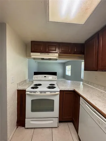 a kitchen with a stove and a sink