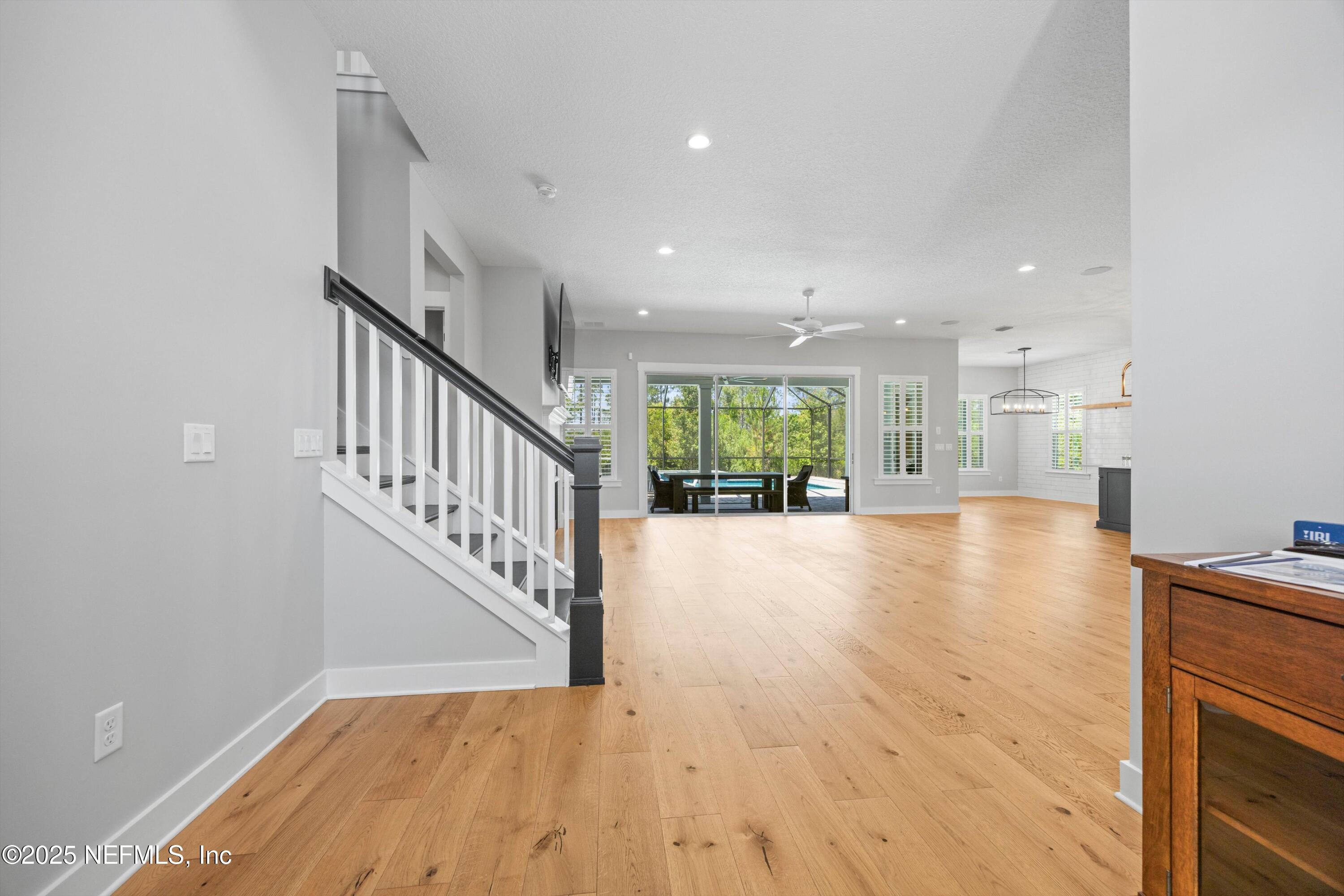 86 Sunset Ridge Court St. Johns, FL 32259 - Photo 11 of 66 a view of an empty room with wooden floor and a window