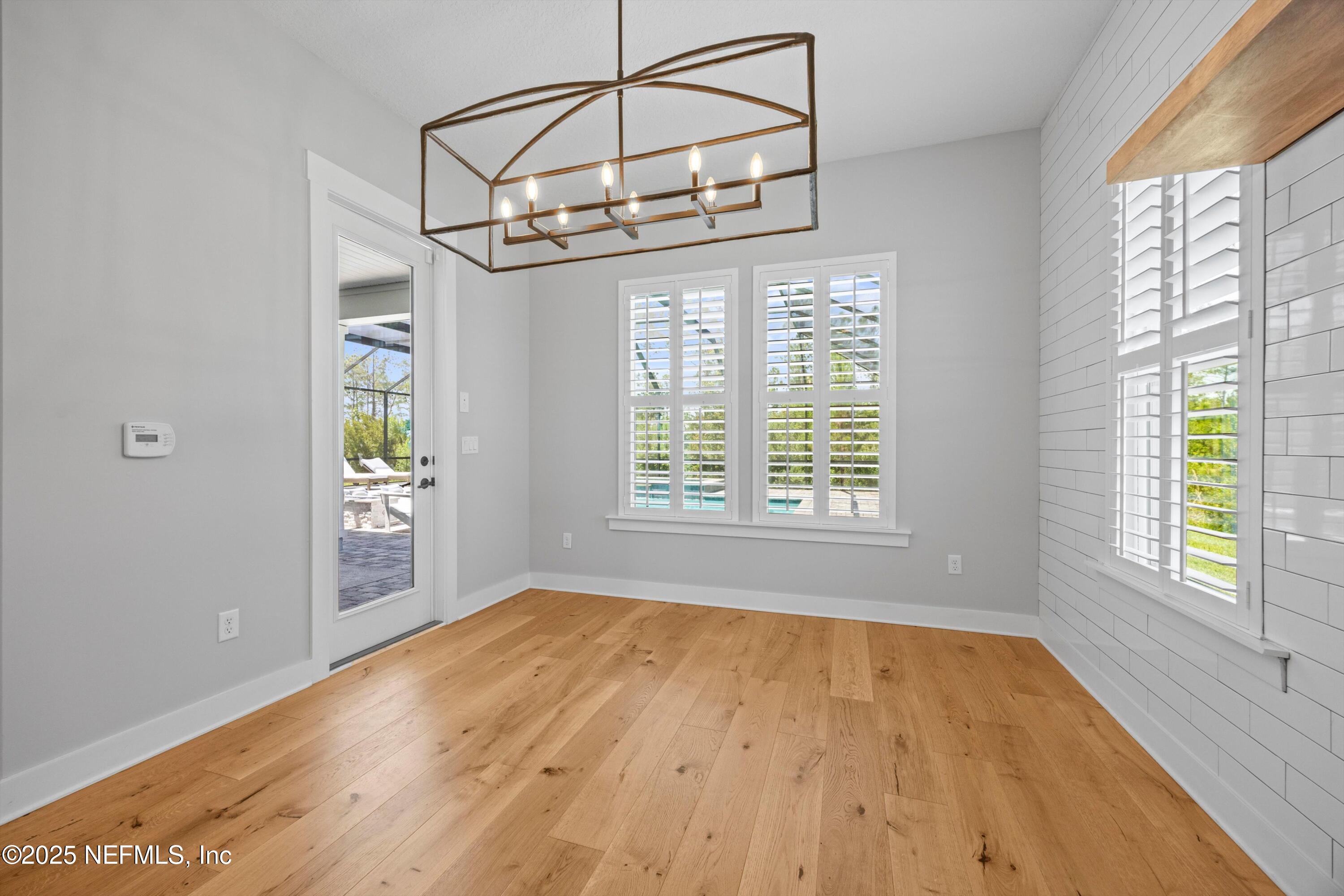86 Sunset Ridge Court St. Johns, FL 32259 - Photo 21 of 66 a view of a room with wooden floor and windows