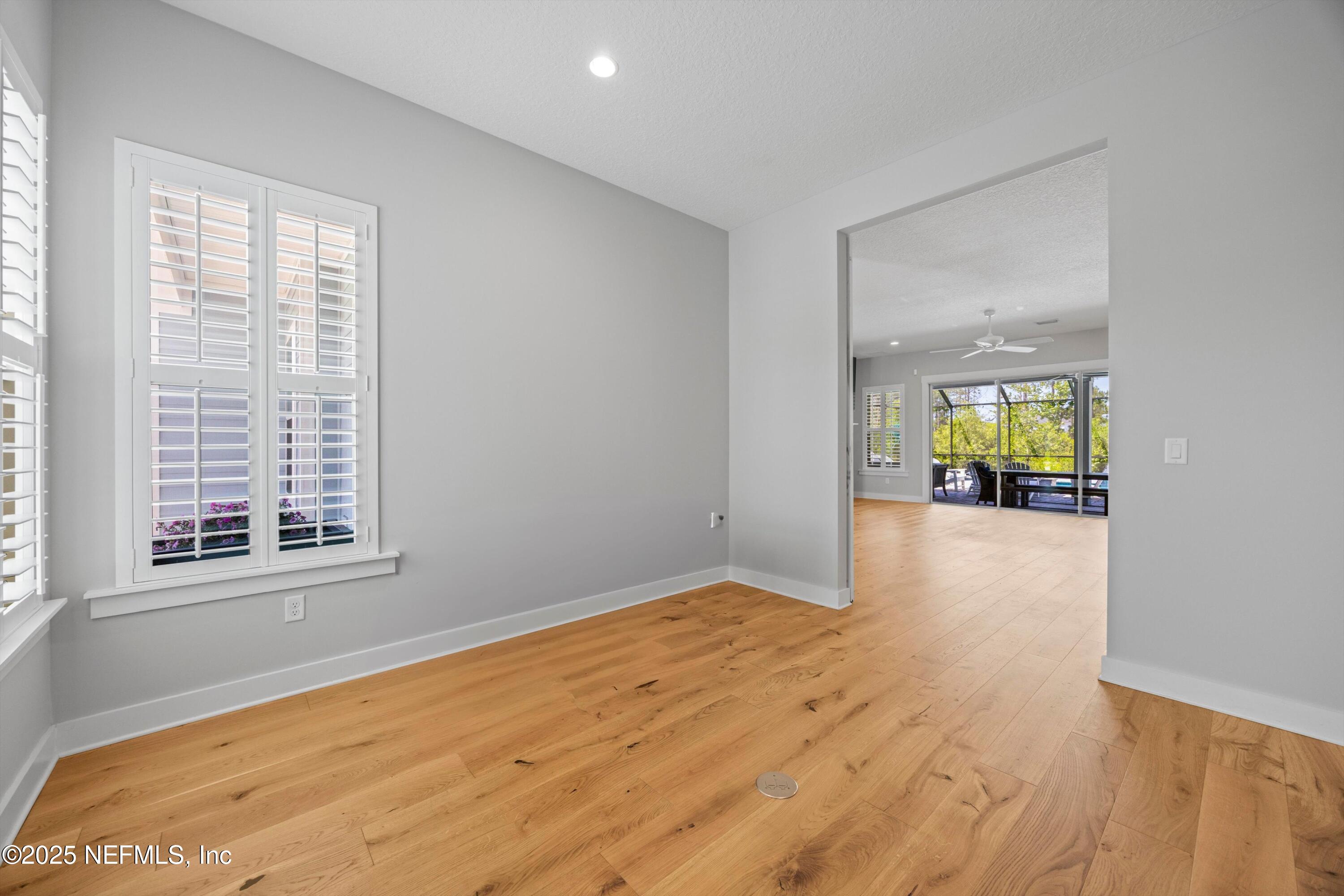 86 Sunset Ridge Court St. Johns, FL 32259 - Photo 24 of 66 a view of an empty room with wooden floor and a window