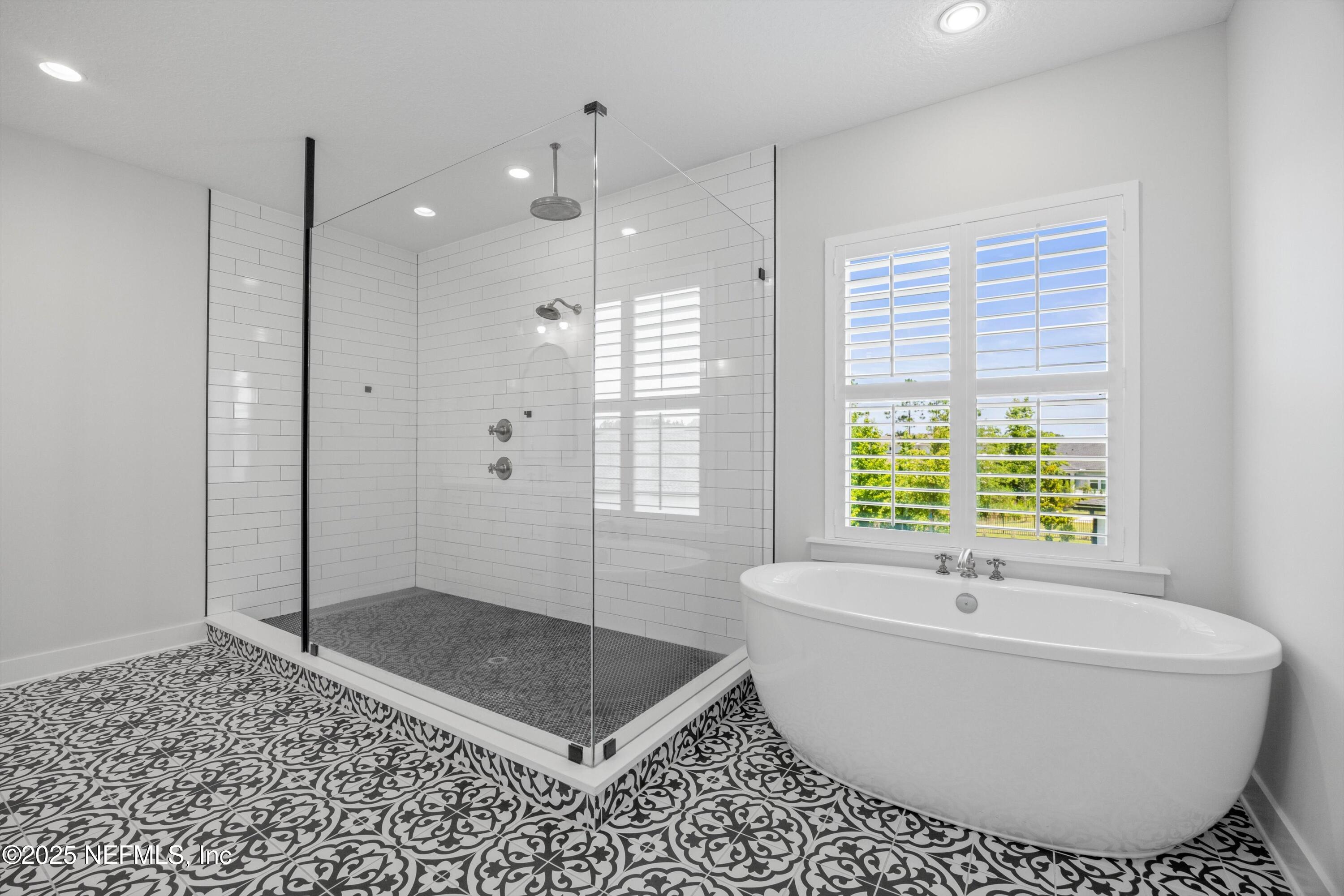 86 Sunset Ridge Court St. Johns, FL 32259 - Photo 28 of 66 a bathroom with a bathtub and shower