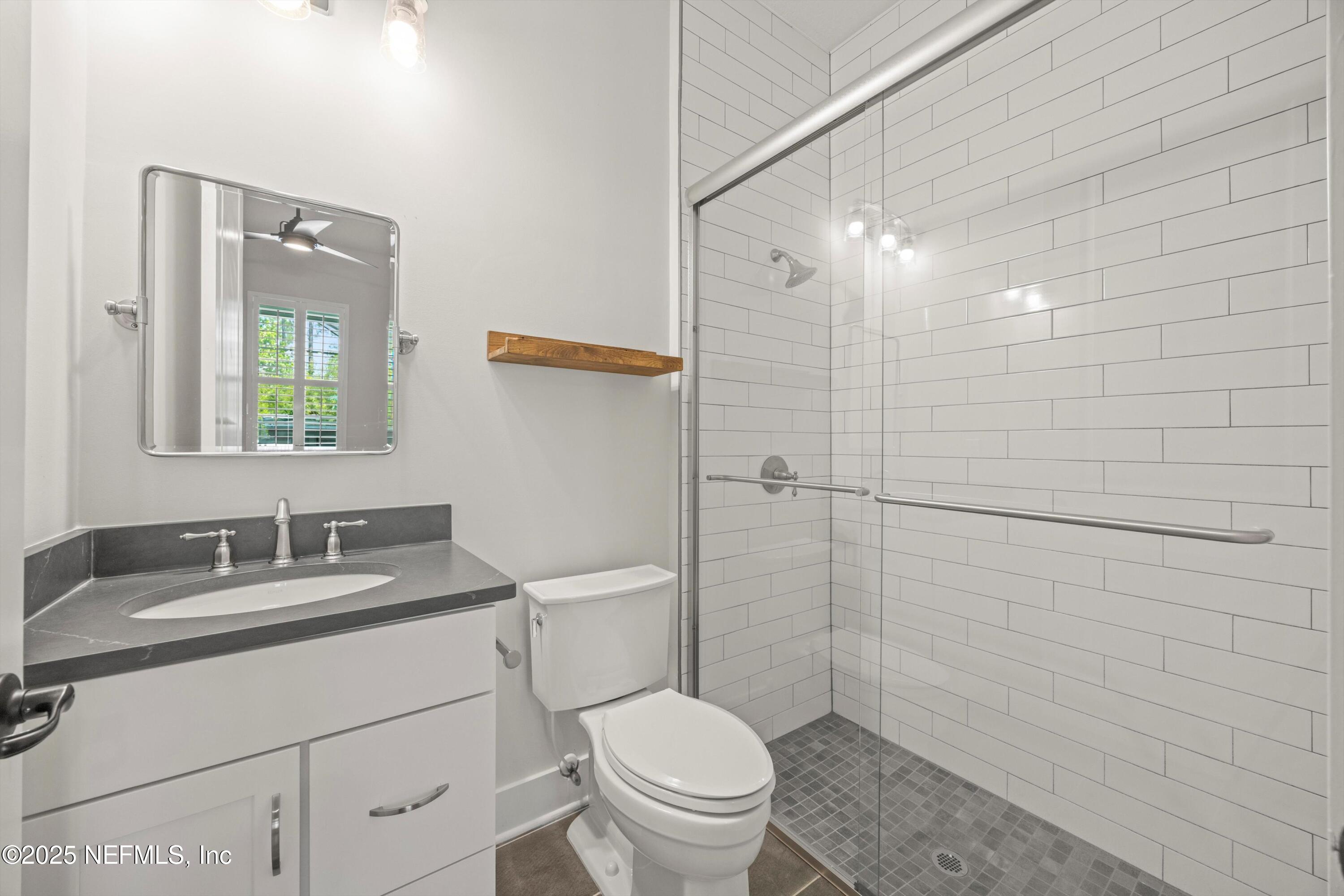 86 Sunset Ridge Court St. Johns, FL 32259 - Photo 41 of 66 a bathroom with a granite countertop sink toilet and shower