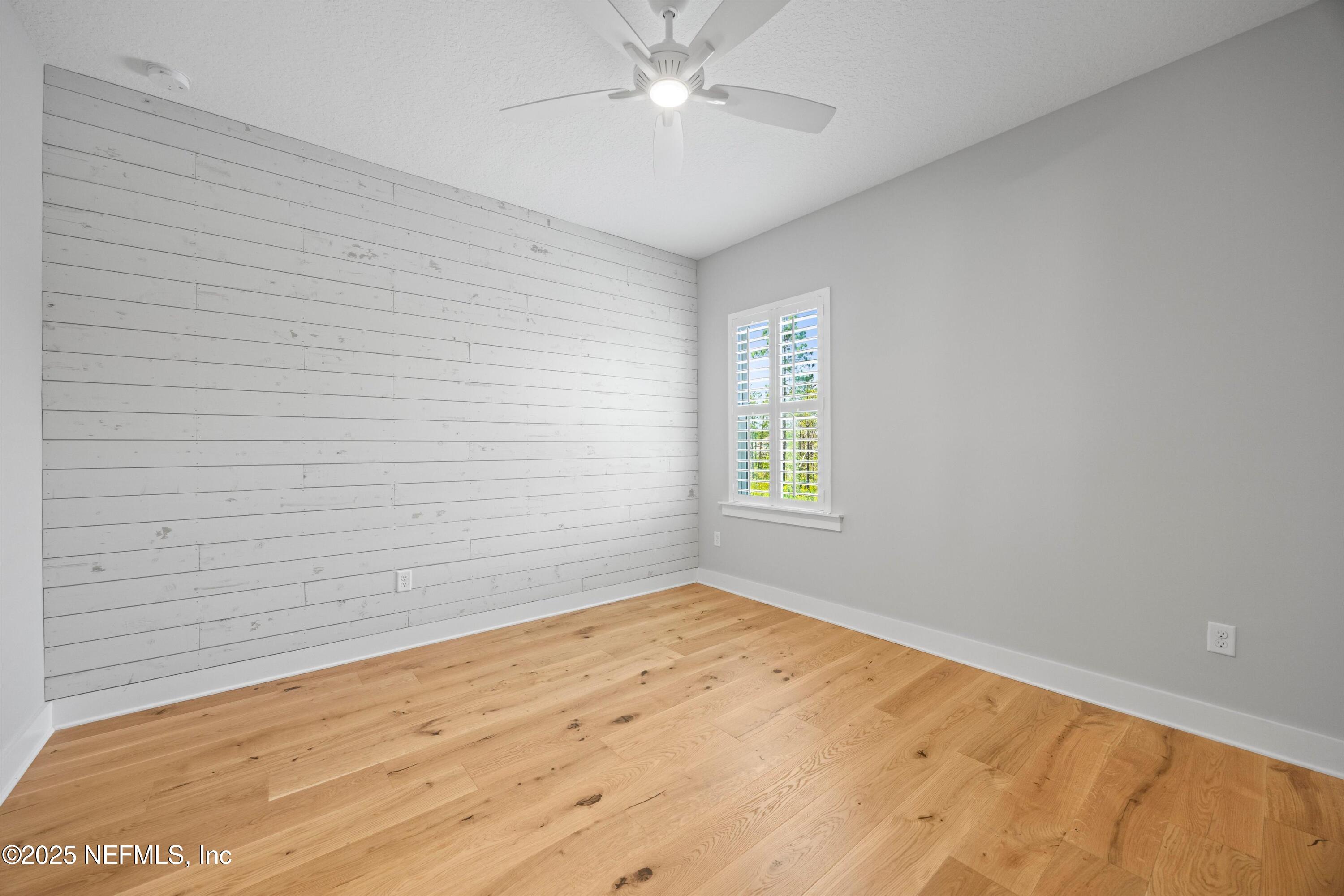 86 Sunset Ridge Court St. Johns, FL 32259 - Photo 45 of 66 an empty room with a window and a ceiling fan