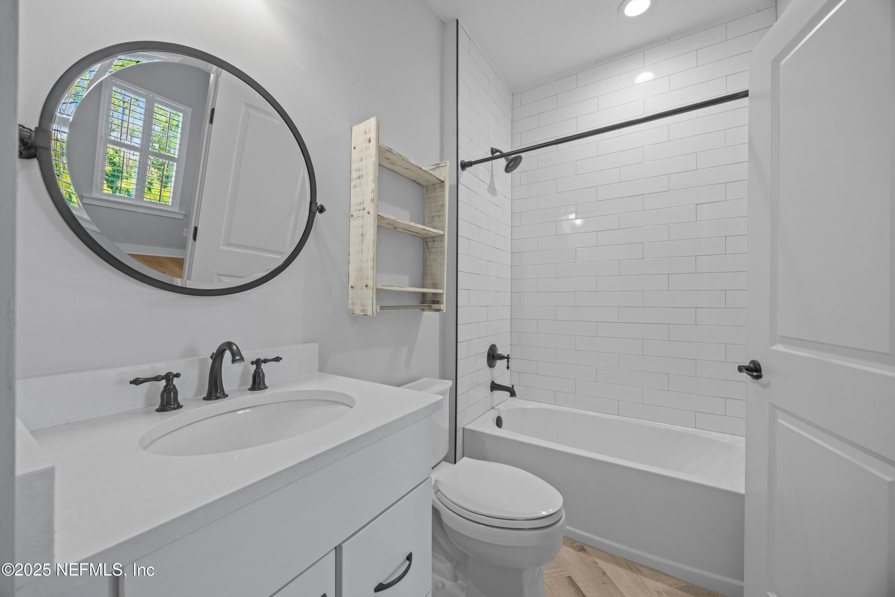 86 Sunset Ridge Court St. Johns, FL 32259 - Photo 47 of 66 a bathroom with a sink toilet and a mirror