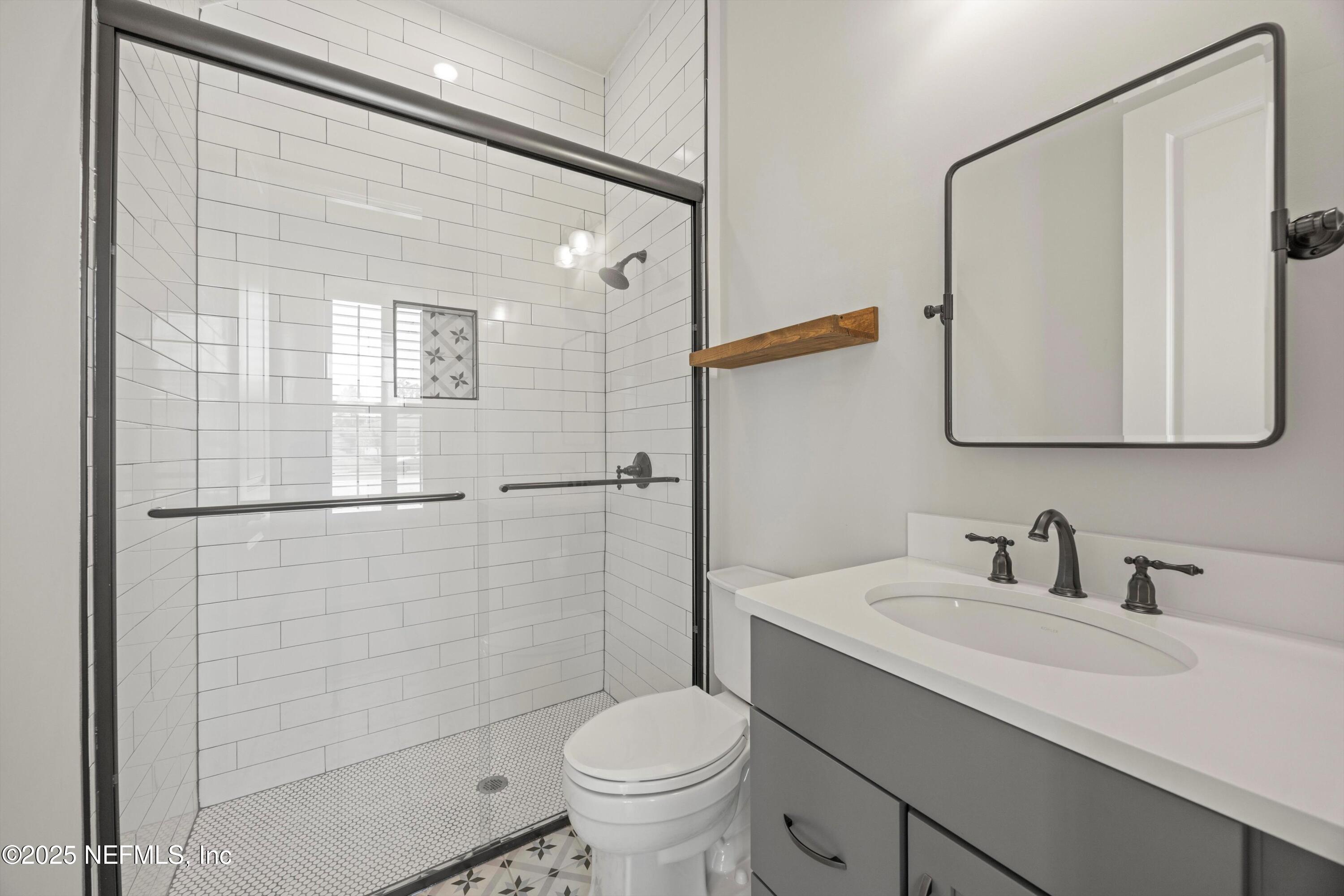 86 Sunset Ridge Court St. Johns, FL 32259 - Photo 51 of 66 a bathroom with a sink toilet and shower