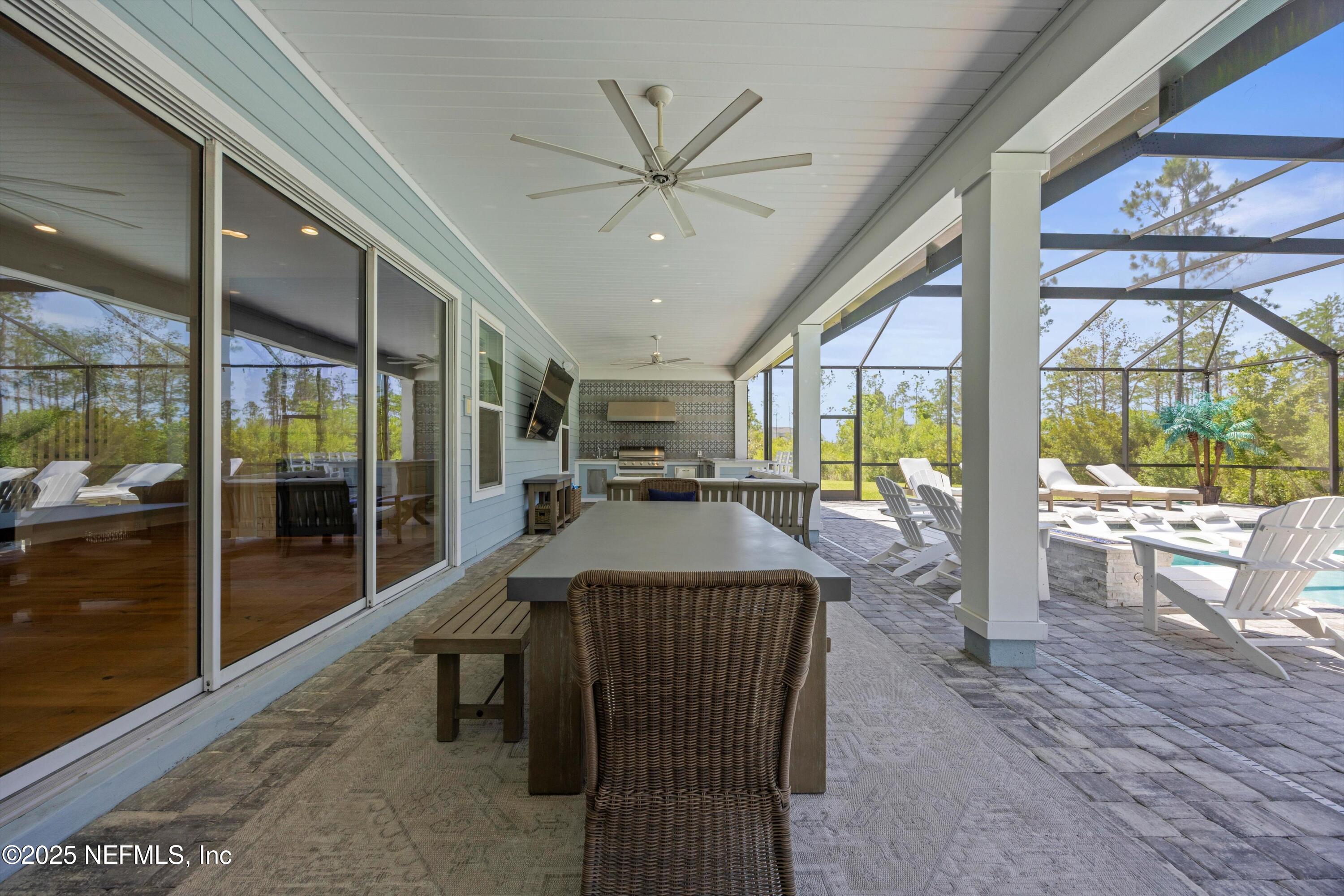 86 Sunset Ridge Court St. Johns, FL 32259 - Photo 57 of 66 a view of a dining room with furniture window and wooden floor