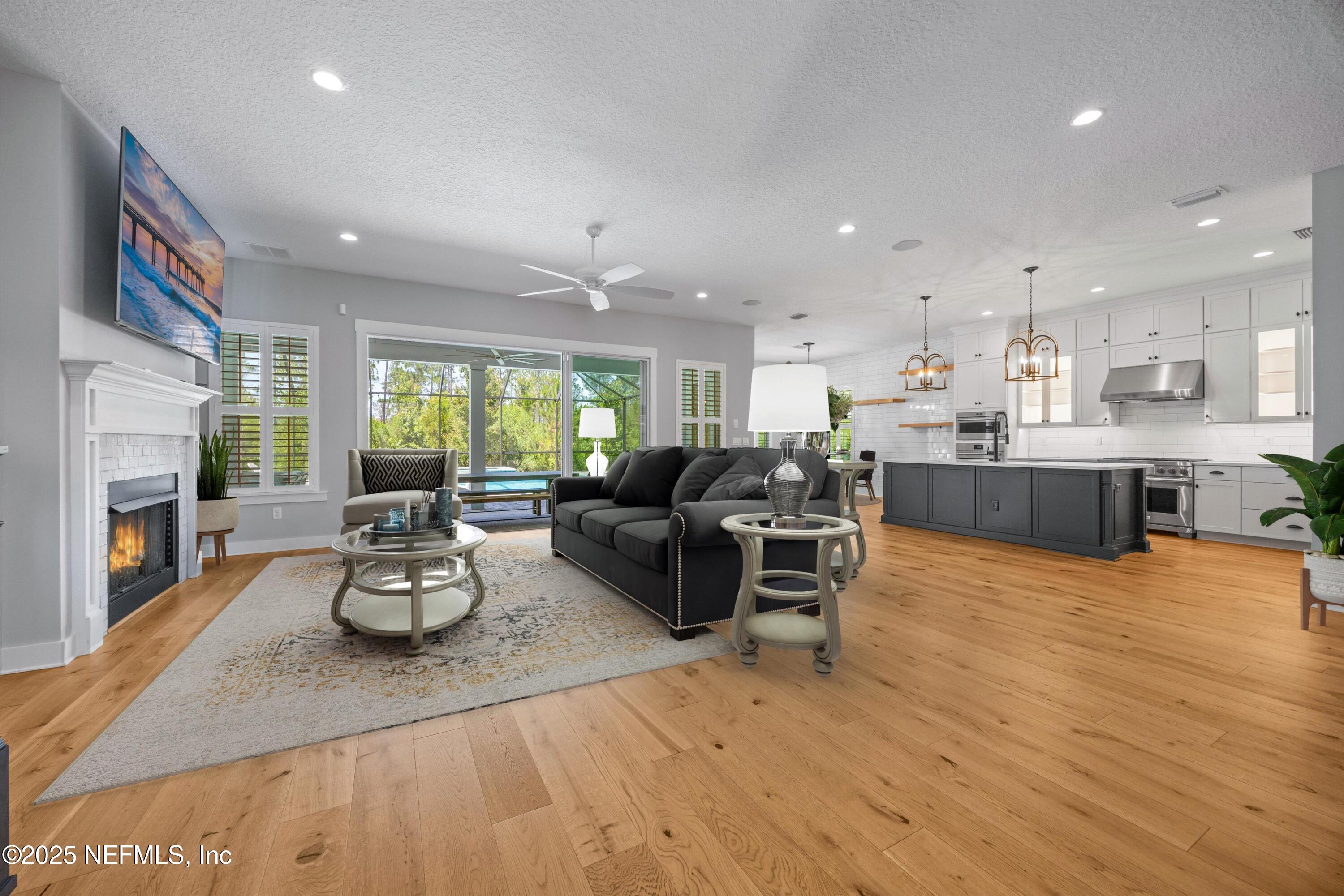 86 Sunset Ridge Court St. Johns, FL 32259 - Photo 9 of 66 a living room with furniture and a wooden floor