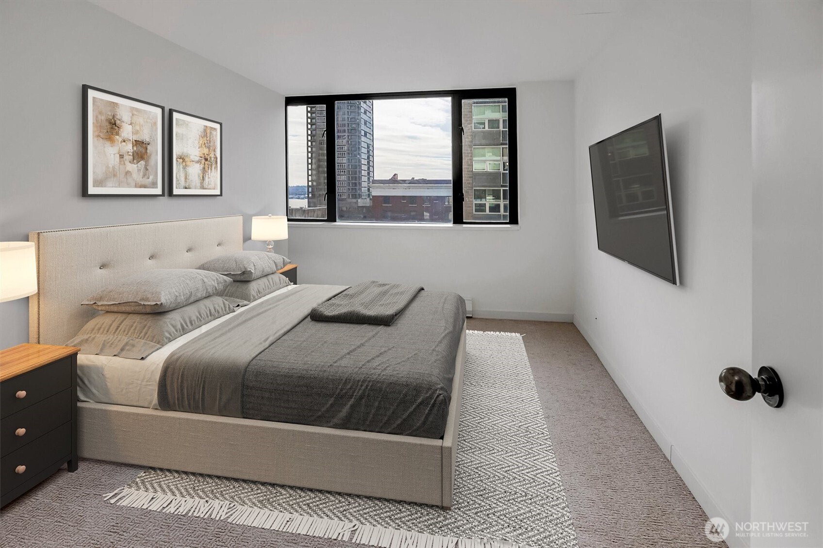 2201 3rd Avenue, Unit 803 Seattle, WA 98121 - Photo 11 of 26 a bedroom with a bed and glass window