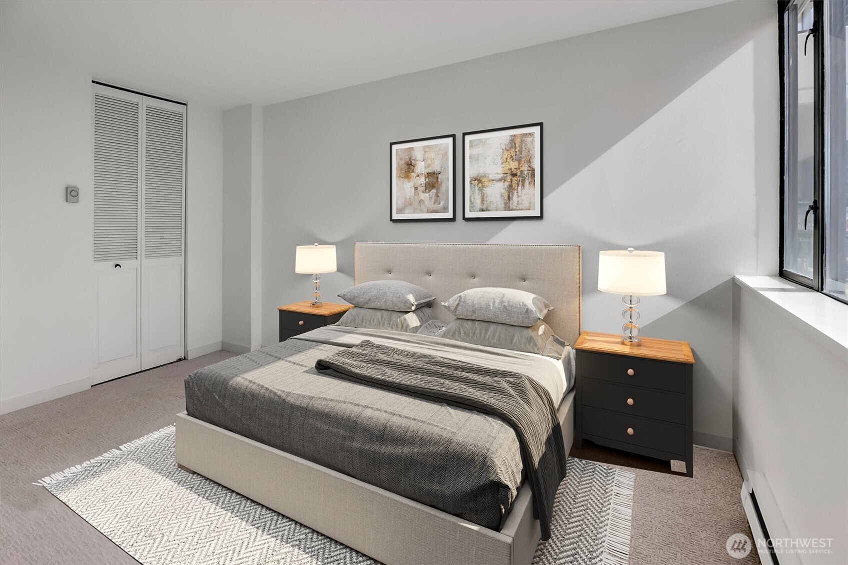 2201 3rd Avenue, Unit 803 Seattle, WA 98121 - Photo 12 of 26 a bedroom with a bed and a night stand