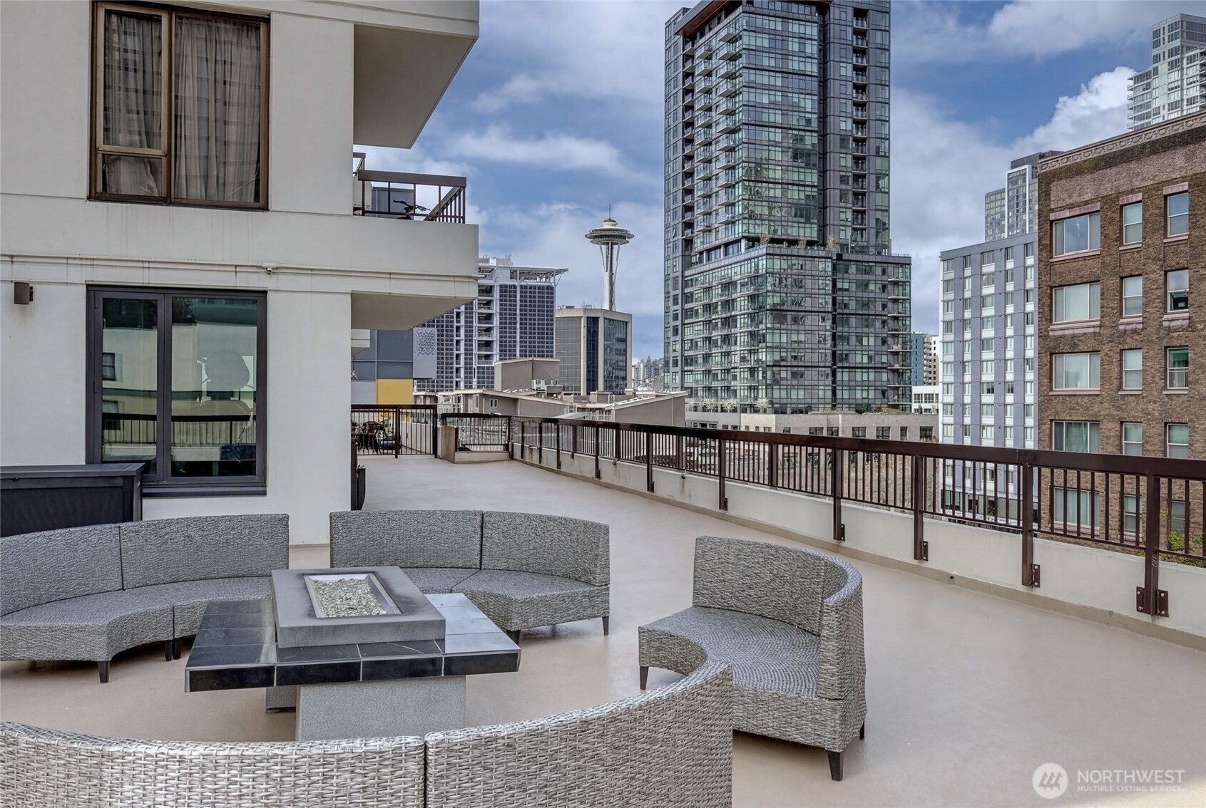 2201 3rd Avenue, Unit 803 Seattle, WA 98121 - Photo 15 of 26 a building outdoor space with patio furniture