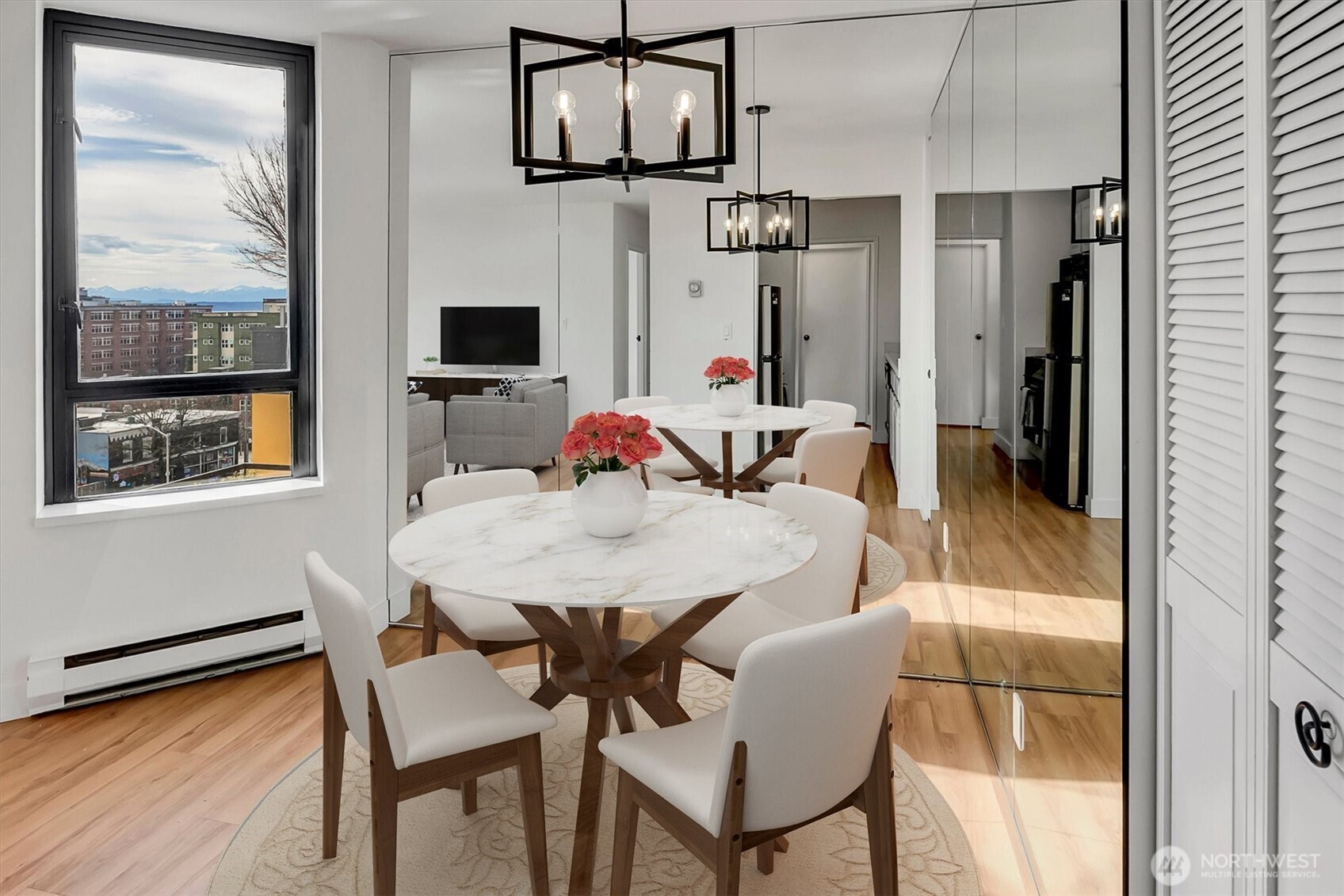 2201 3rd Avenue, Unit 803 Seattle, WA 98121 - Photo 6 of 26 a view of a dining room with furniture and a window