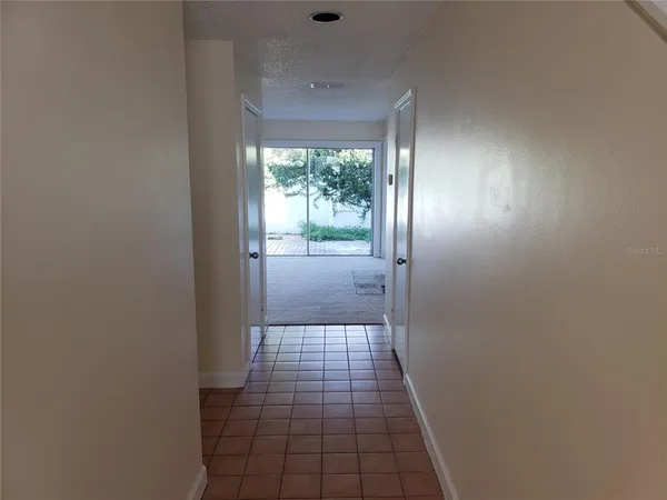 a bathroom with a glass door shower