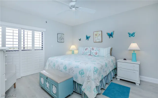 a bedroom with a bed and a table